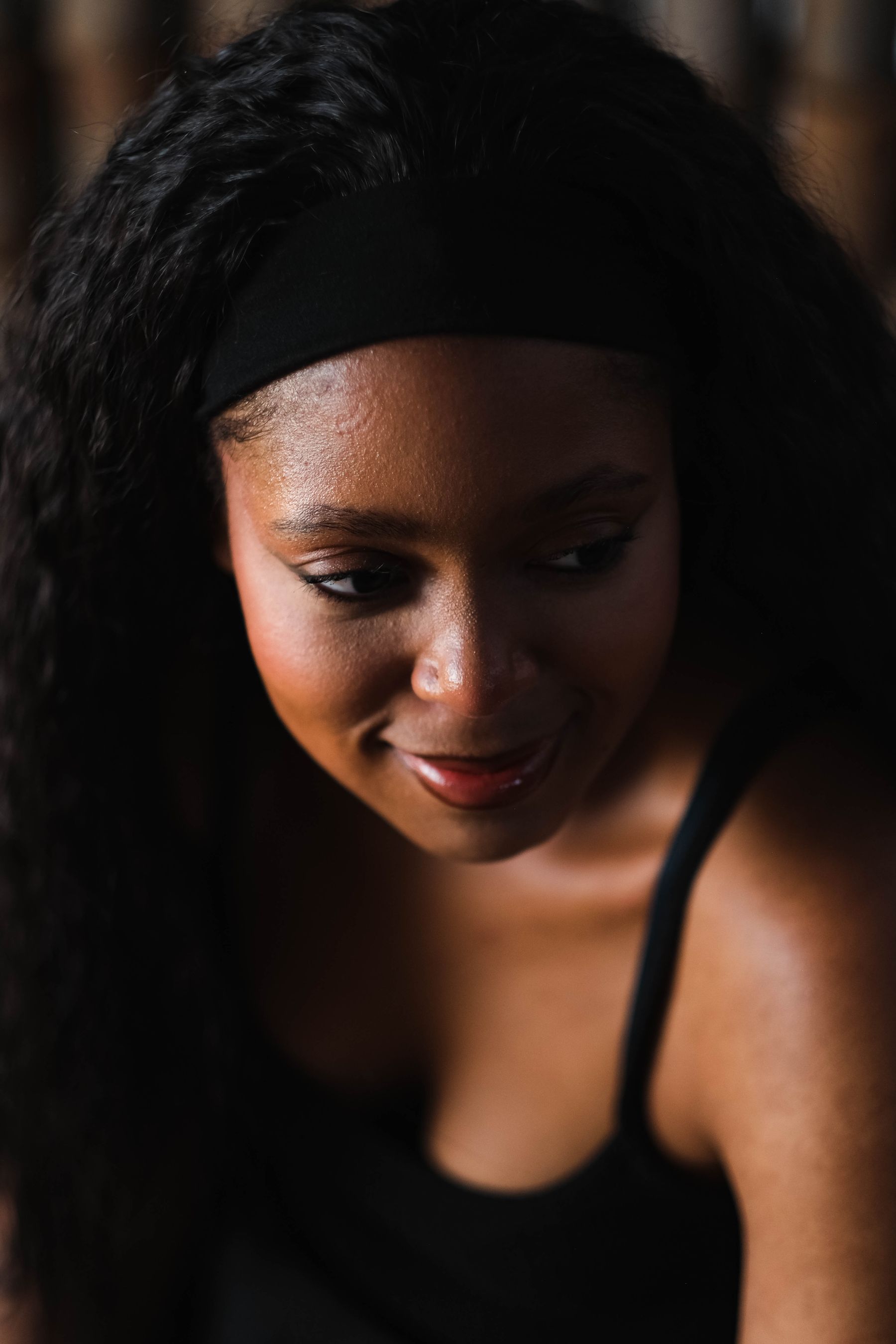 Smiling woman with long curly hair